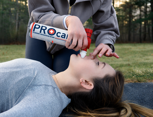 Responder delivering a PRO-Breath rescue breath with the PROcan oxygen canister during CPR